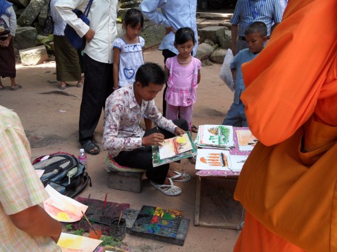 Cambodian artist outside Ta Prohm
