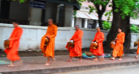 Monks walking through the streets of Luang Prabang
