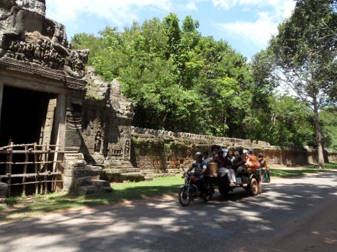 Motorcycle carrying many people and cargo