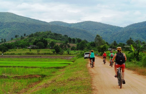 Color photo biking through the country side in Chiang Rai Thailand