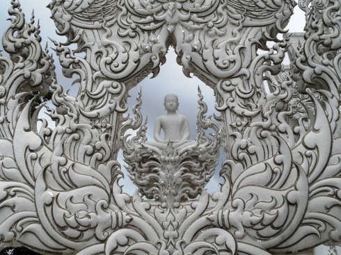 color photo of white buddha statue in Thailand